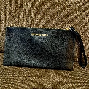 Black leather Michael Kors wristlet wallet.